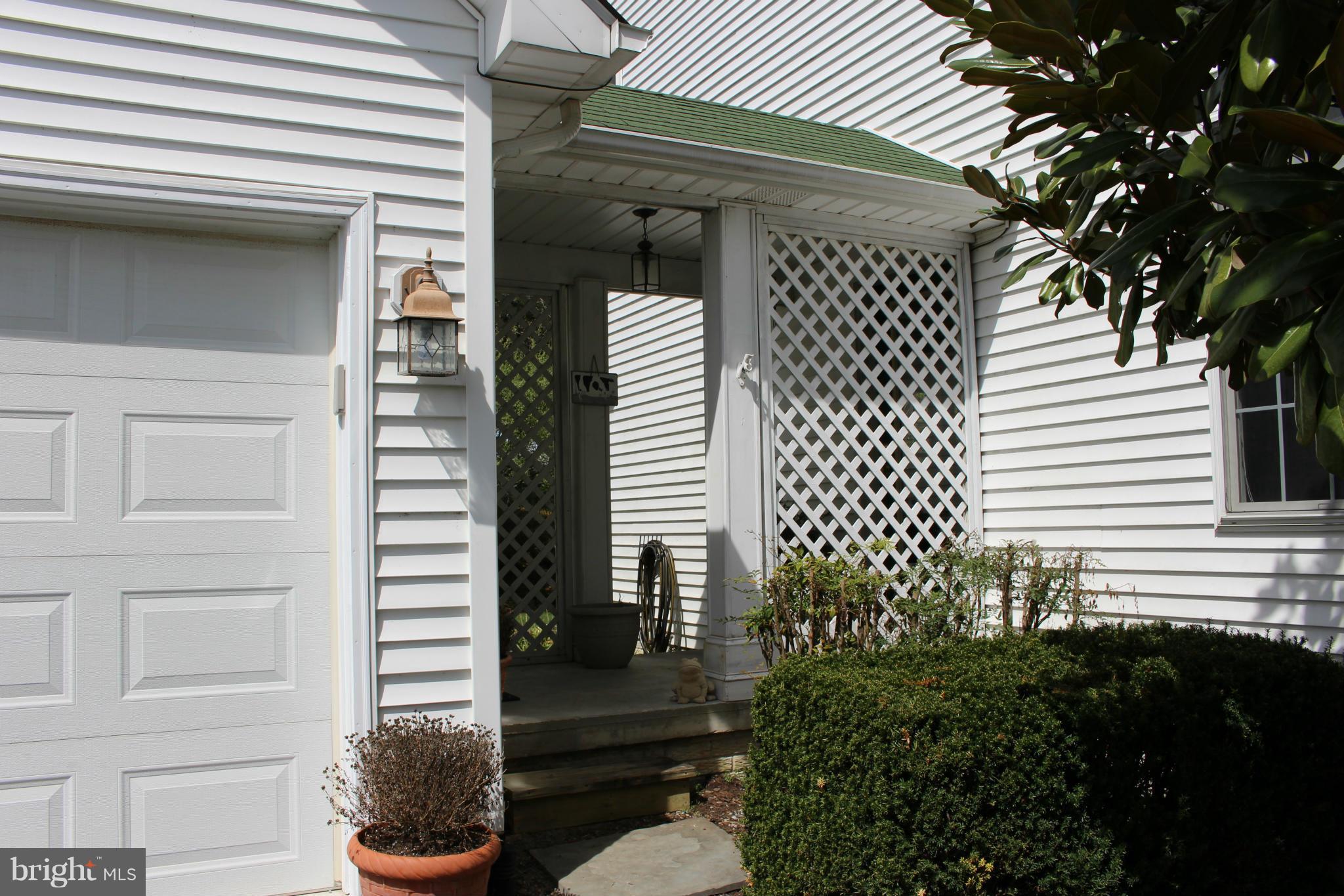 245 Milldale Road Front Royal, VA 22630 - Photo 2 of 29 a view of a house with a door and a potted plant