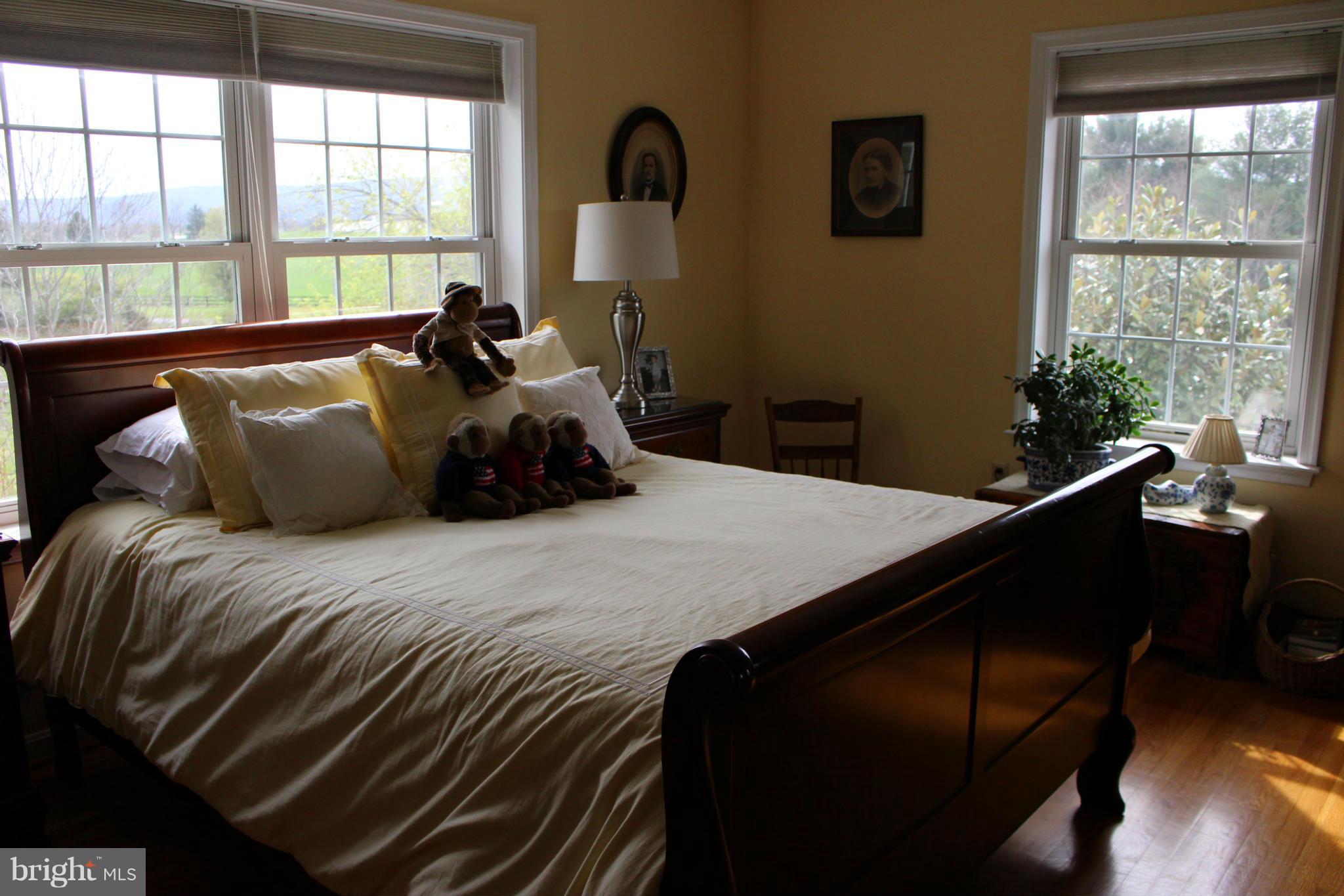 245 Milldale Road Front Royal, VA 22630 - Photo 18 of 29 a bed sitting in a bedroom next to a window