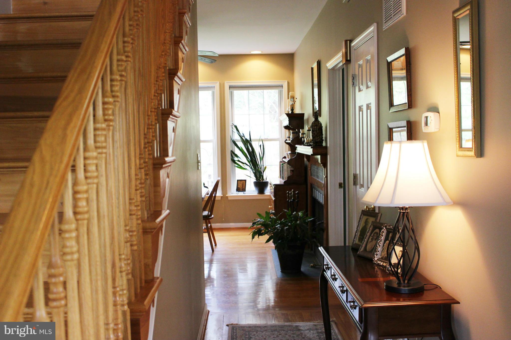 245 Milldale Road Front Royal, VA 22630 - Photo 3 of 29 a view of a hallway with wooden floor and furniture
