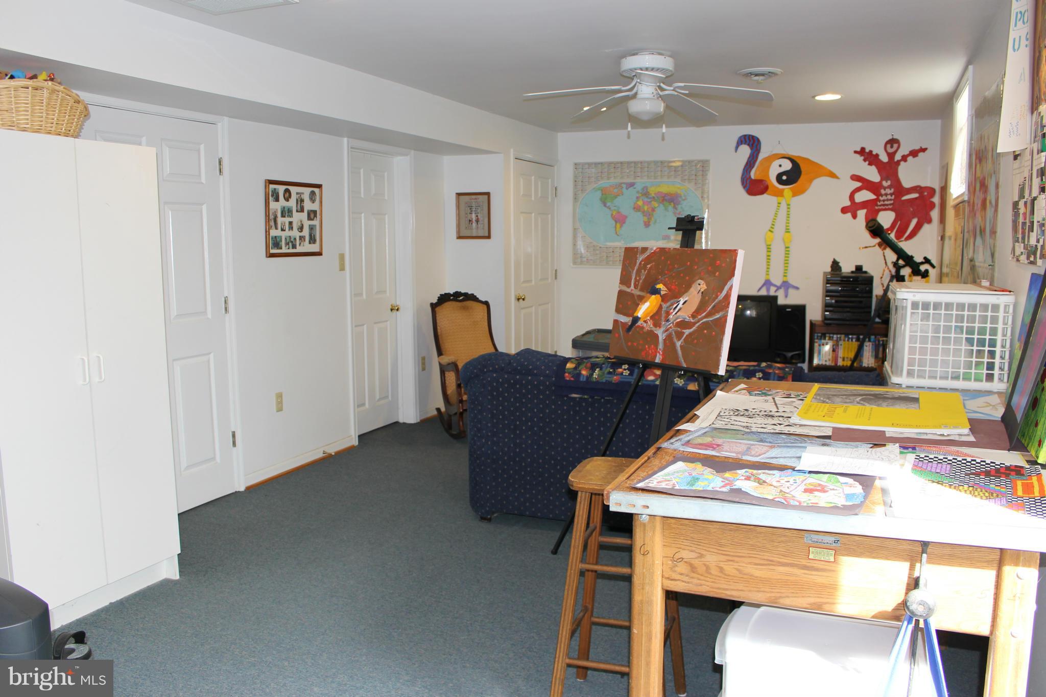 245 Milldale Road Front Royal, VA 22630 - Photo 22 of 29 a living room with furniture and a flat screen tv