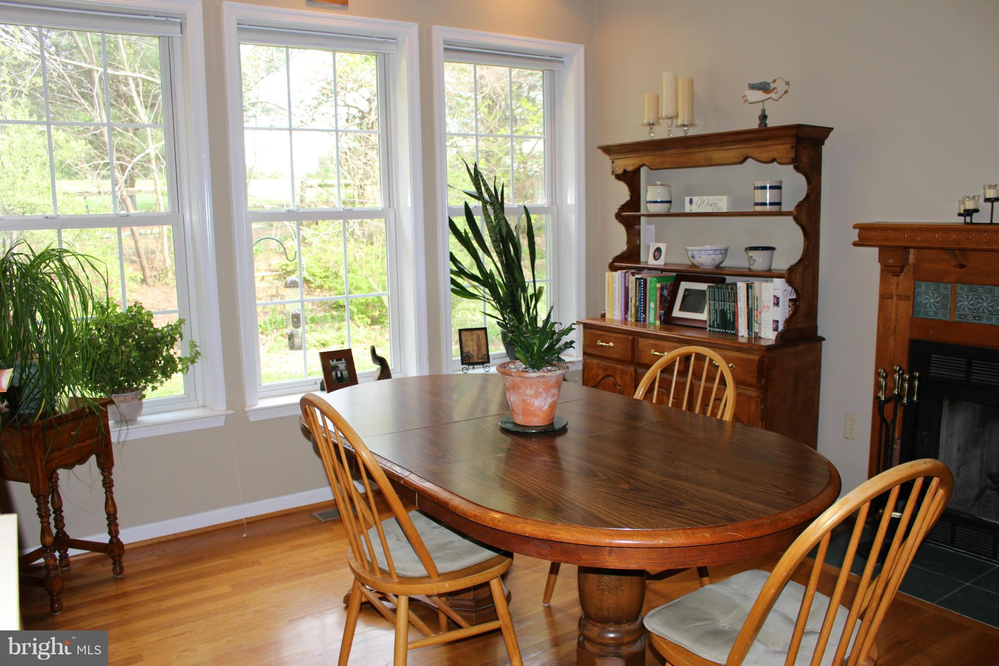 245 Milldale Road Front Royal, VA 22630 - Photo 7 of 29 a view of a dining room with furniture window and wooden floor