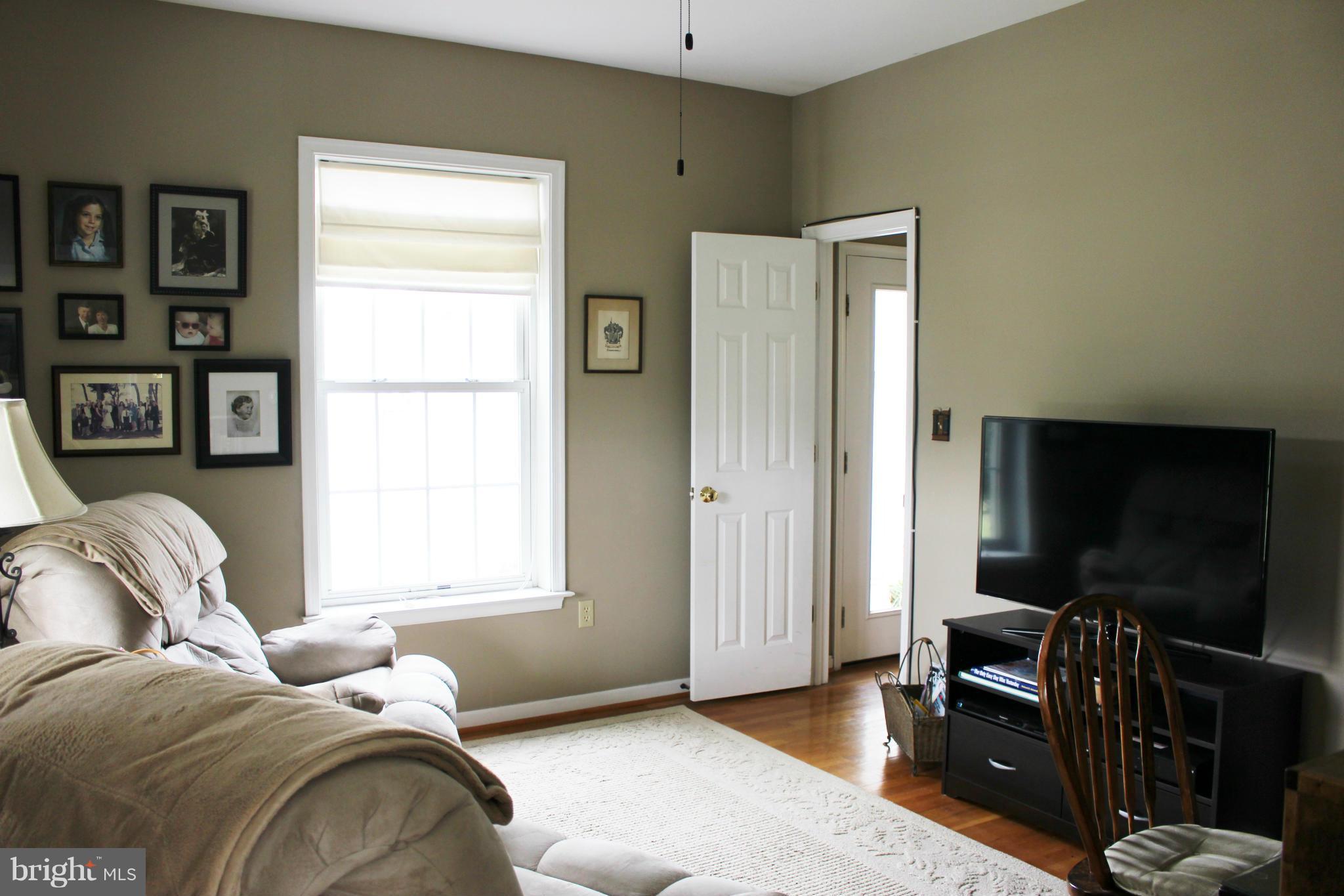 245 Milldale Road Front Royal, VA 22630 - Photo 8 of 29 a bedroom with furniture and a flat screen tv
