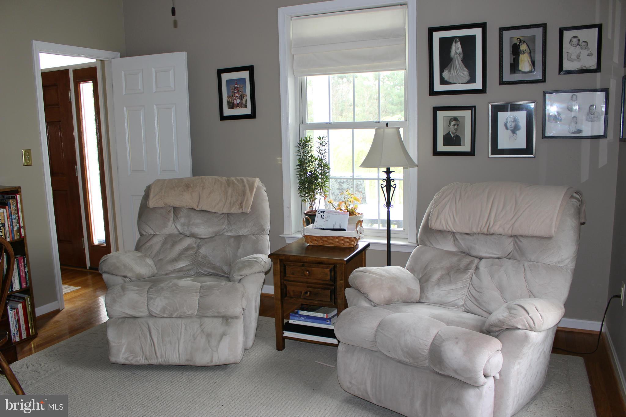 245 Milldale Road Front Royal, VA 22630 - Photo 9 of 29 a living room with furniture and a large window