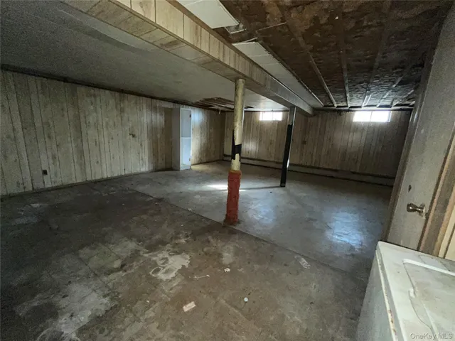 a view of empty room with stairs