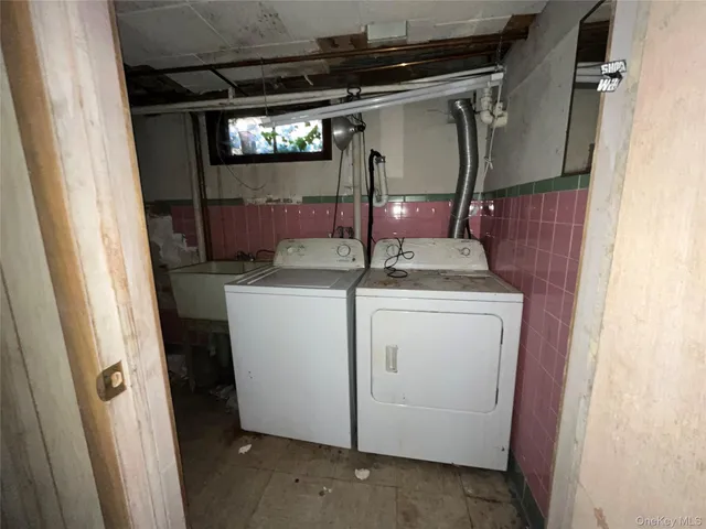 a utility room with dryer and washer