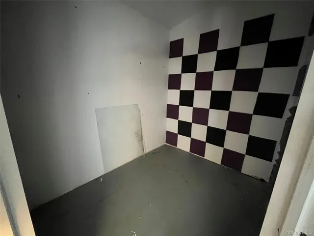 a view of a large window in a black white checkered floor