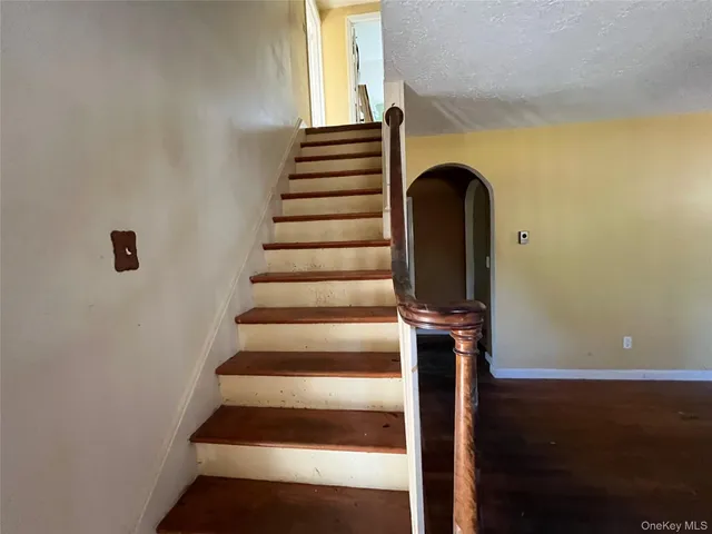 a front view of a house with stairs
