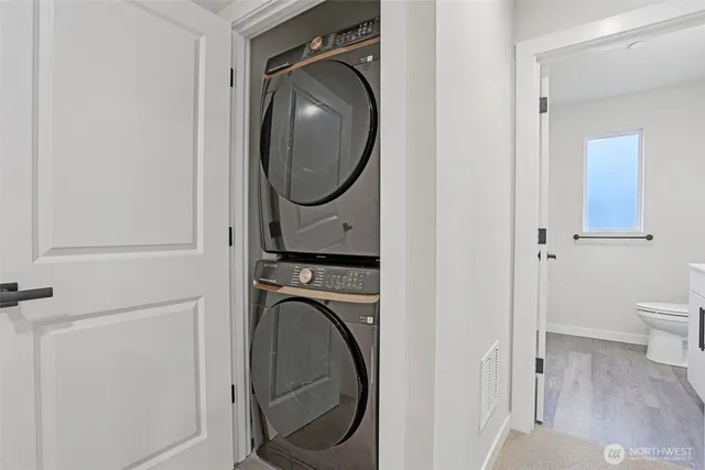 a view of a hallway with washer and dryer