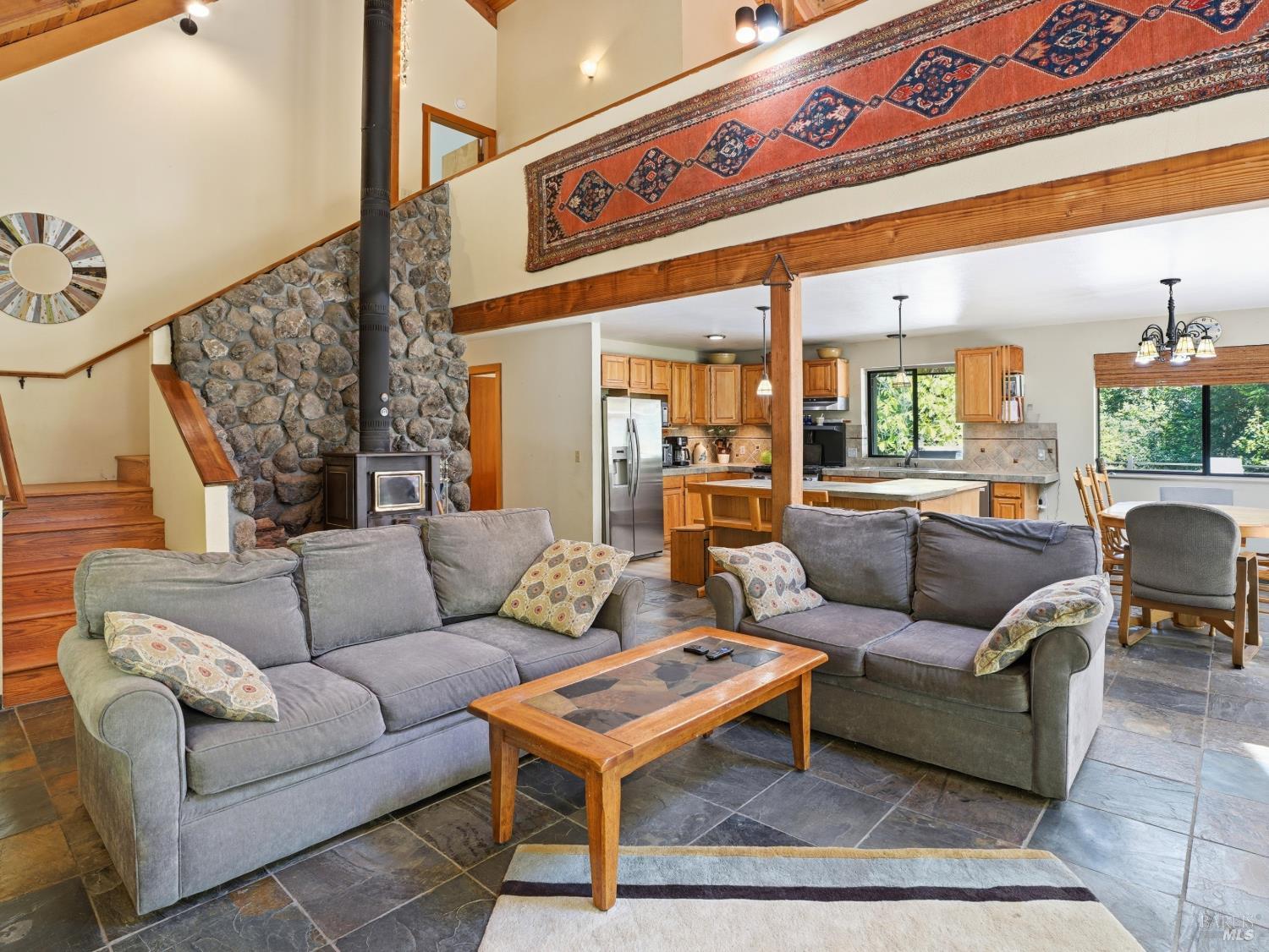 31397 Seaview Road Cazadero, CA 95421 - Photo 6 of 47 a living room with furniture and a rug