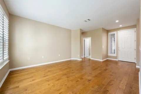 a view of a livingroom with a window and a ceiling fan