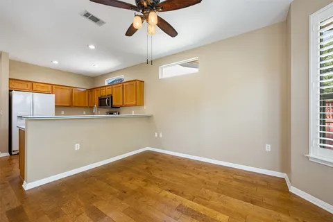 a view of a kitchen with a sink and cabinets