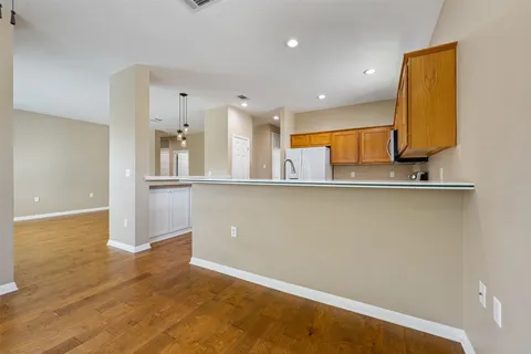 a view of a kitchen with a sink and cabinets