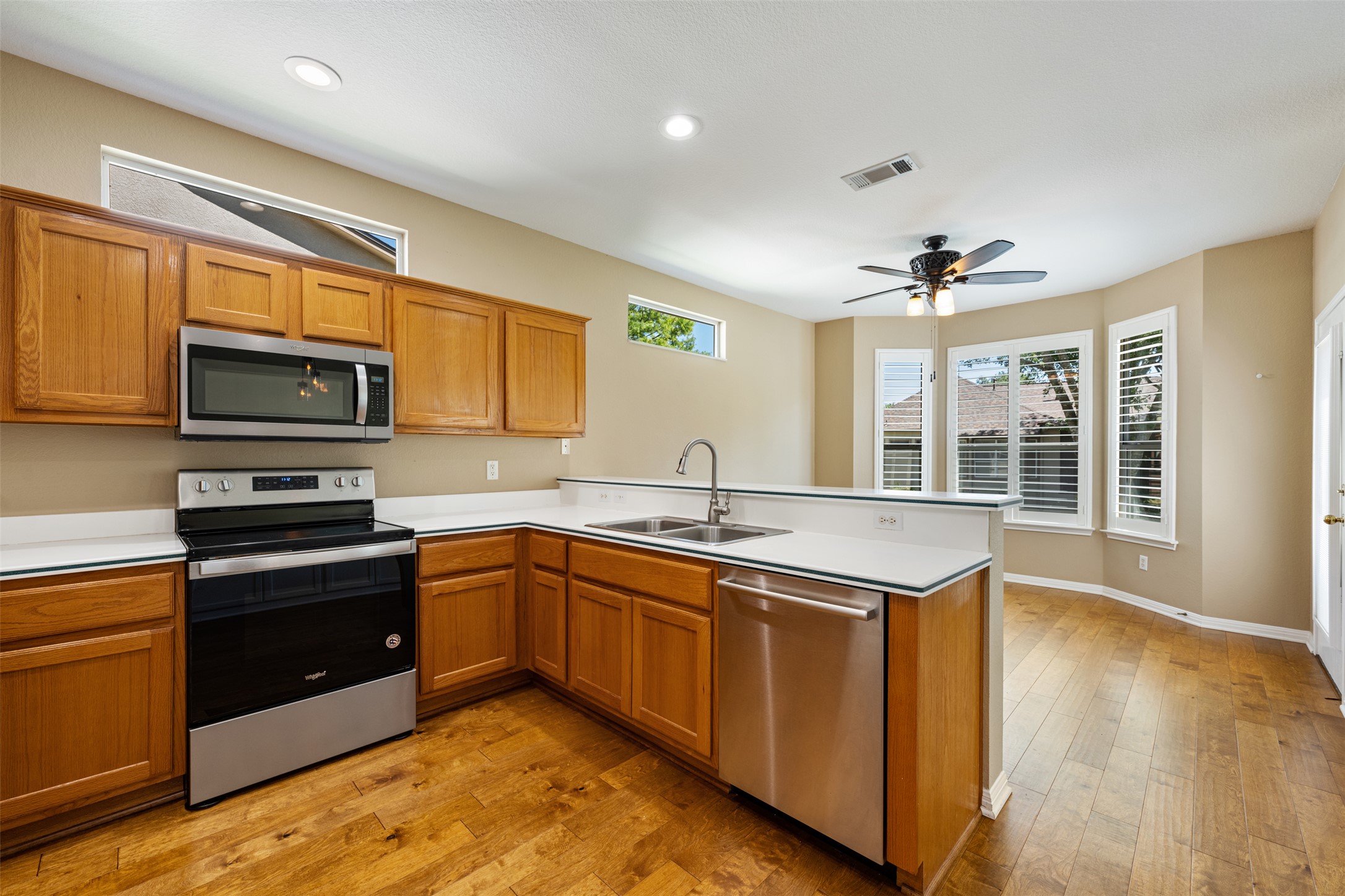 118 Purple Sage Drive Georgetown, TX 78633 - Photo 17 of 31 a kitchen with stainless steel appliances granite countertop a sink and stove top oven