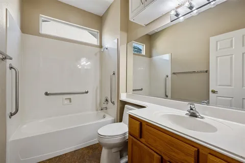 a bathroom with a sink a toilet and a bathtub