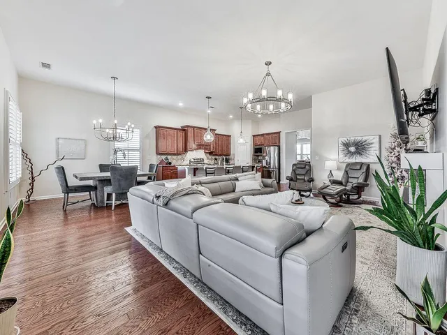 a bathroom with a granite countertop bathtub sink and mirror