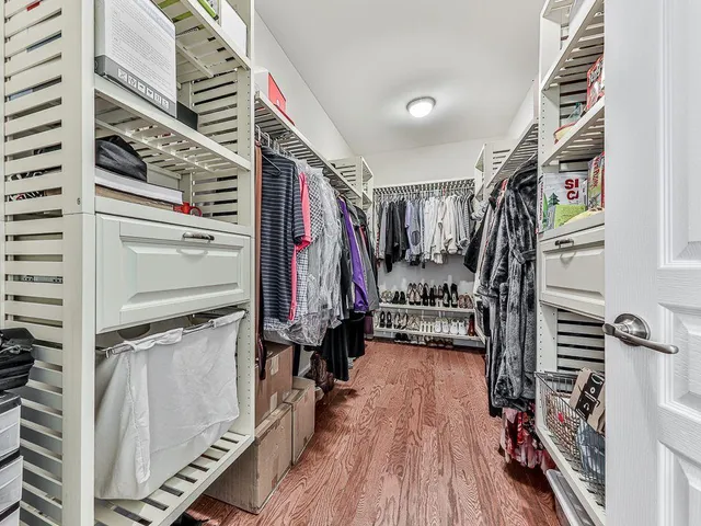 a bathroom with a granite countertop sink a toilet and a mirror