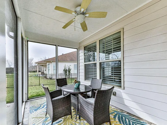 a room with lots of furniture and a rug