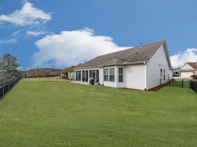 a view of balcony with wooden floor and outdoor seating