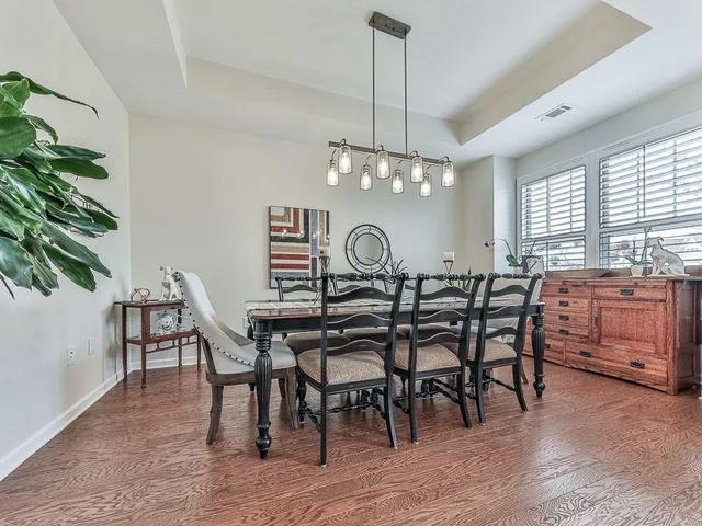 a kitchen with stainless steel appliances granite countertop a stove and cabinets