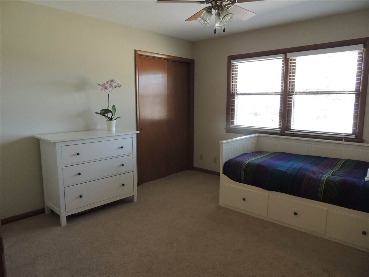 4114 Cushman Road Rockford, IL 61114 - Photo 18 of 25 a bedroom with a bed and a dresser