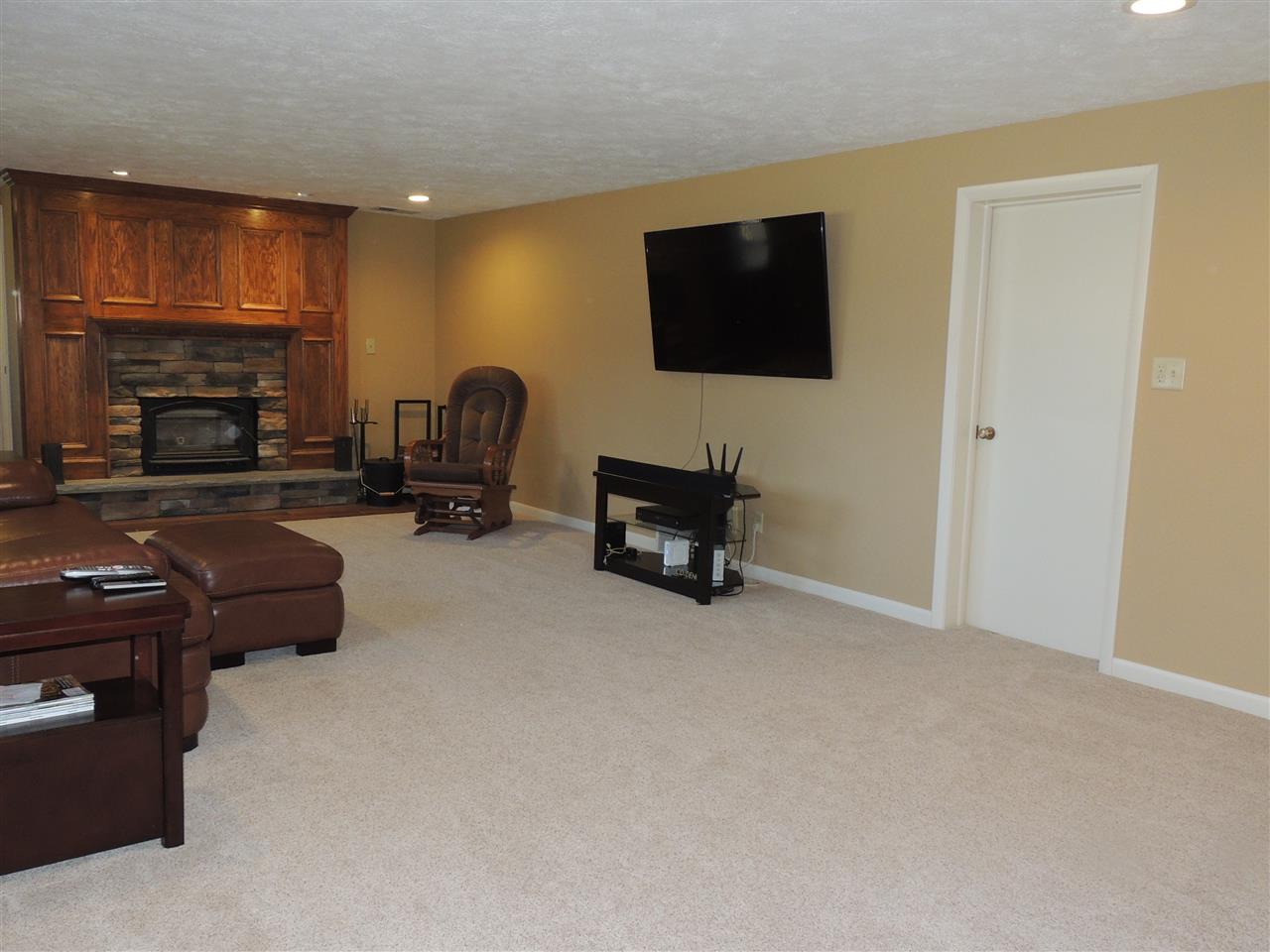 4114 Cushman Road Rockford, IL 61114 - Photo 20 of 25 a living room with furniture and a flat screen tv