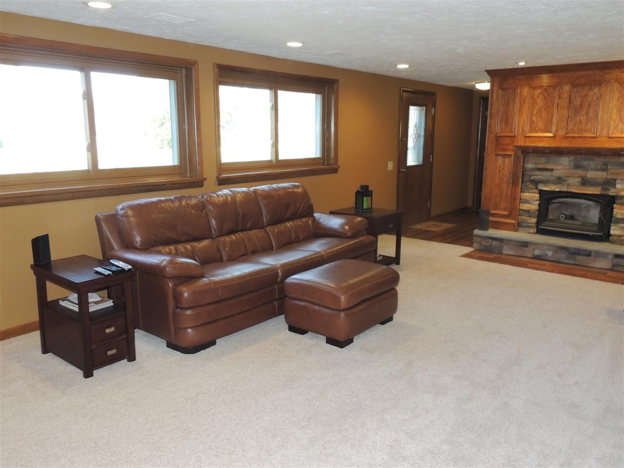 4114 Cushman Road Rockford, IL 61114 - Photo 21 of 25 a living room with furniture window and a fireplace