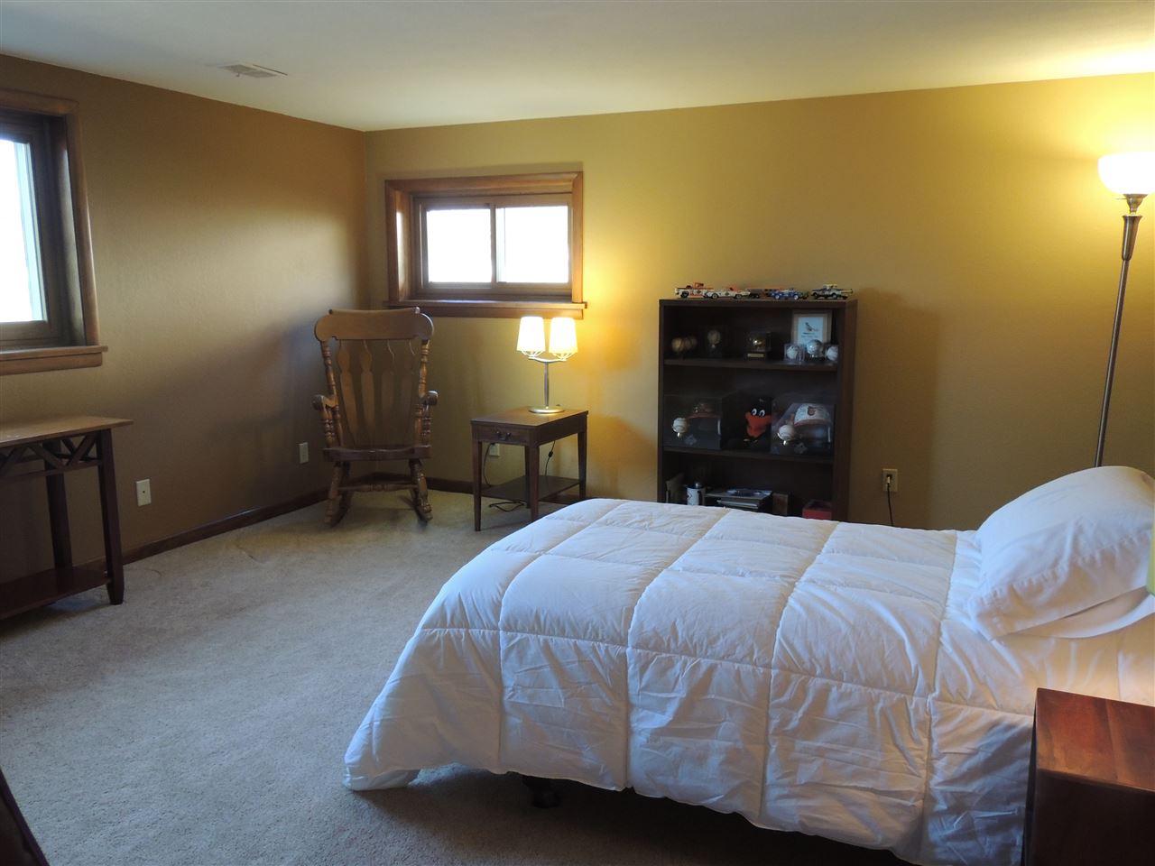 4114 Cushman Road Rockford, IL 61114 - Photo 24 of 25 a bedroom with a bed and dresser with chair
