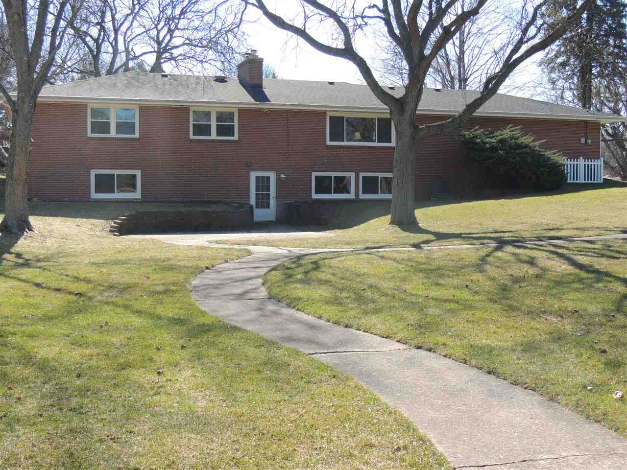 4114 Cushman Road Rockford, IL 61114 - Photo 3 of 25 a view of the house with snow on the road