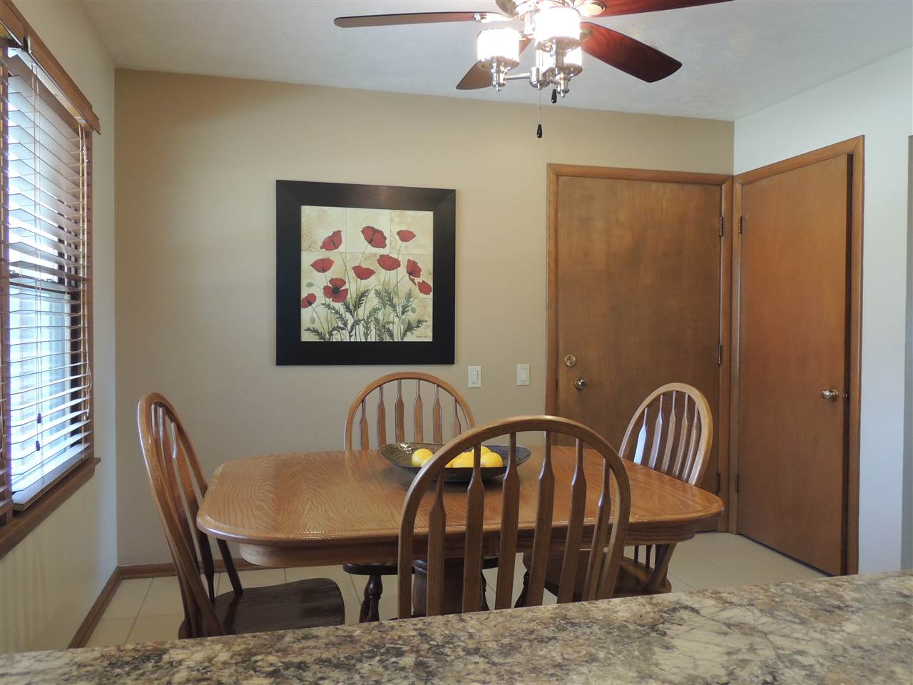4114 Cushman Road Rockford, IL 61114 - Photo 8 of 25 a view of a dining room with furniture window and wooden floor