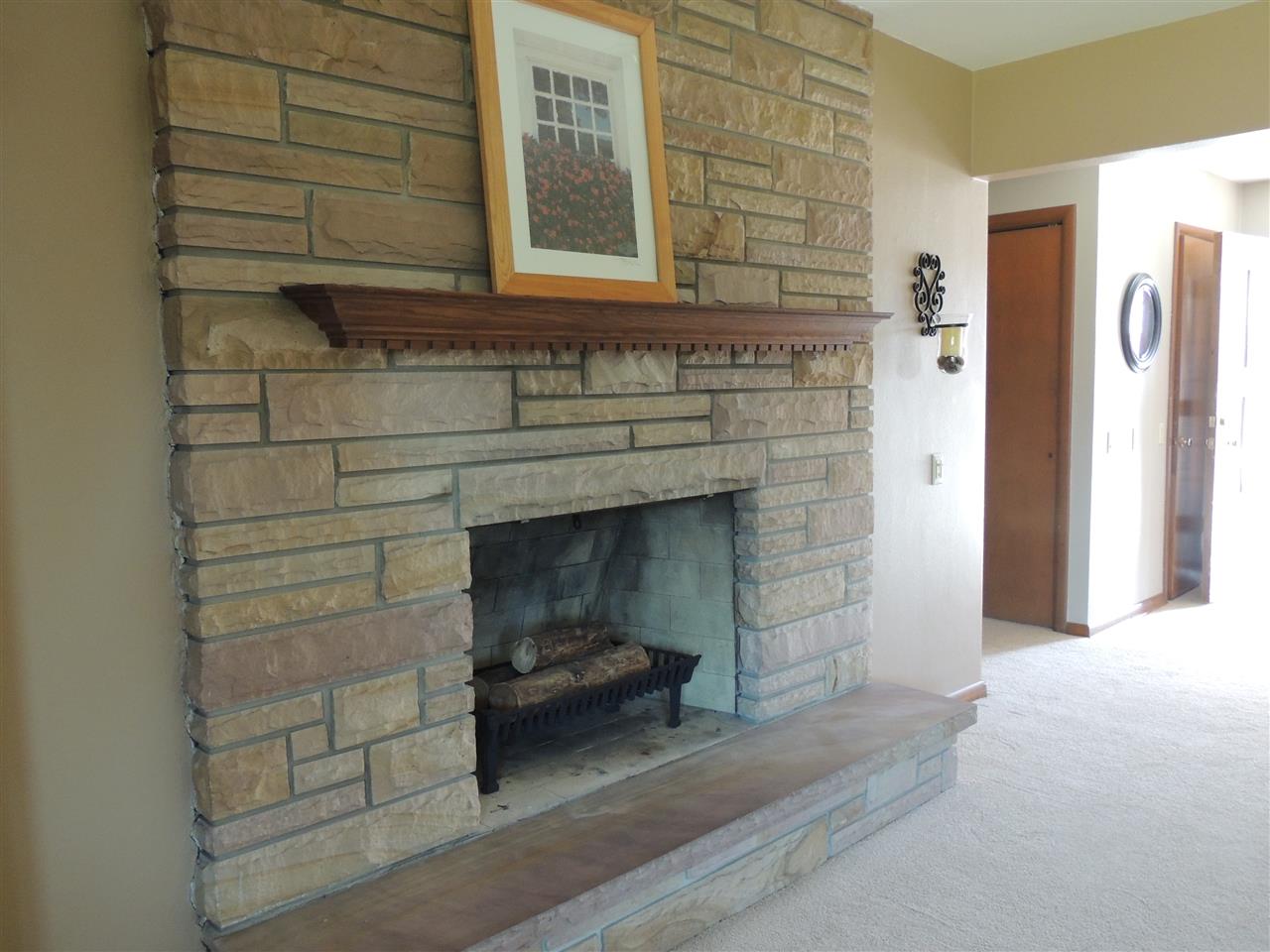 4114 Cushman Road Rockford, IL 61114 - Photo 10 of 25 a view of a fireplace in the room