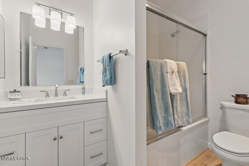 900 South Meadows Parkway, Unit 3322 Reno, NV 89521 - Photo 12 of 35 a bathroom with a sink a toilet a mirror and shower
