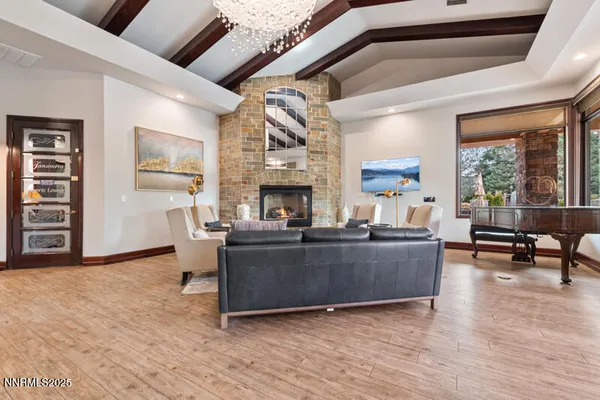 a living room with furniture a rug and a large window