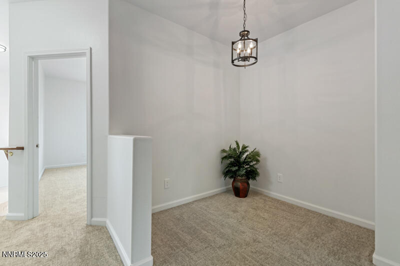 900 South Meadows Parkway, Unit 3322 Reno, NV 89521 - Photo 3 of 35 a view of a hallway with a chandelier