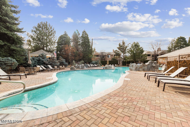 900 South Meadows Parkway, Unit 3322 Reno, NV 89521 - Photo 35 of 35 a view of a lake with a bench and trees around