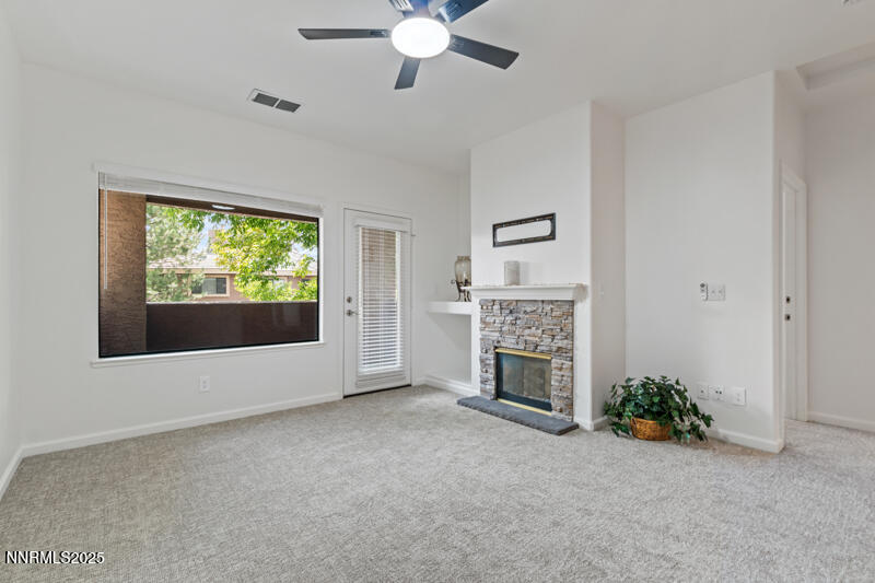 900 South Meadows Parkway, Unit 3322 Reno, NV 89521 - Photo 5 of 35 a view of an empty room with window and fireplace