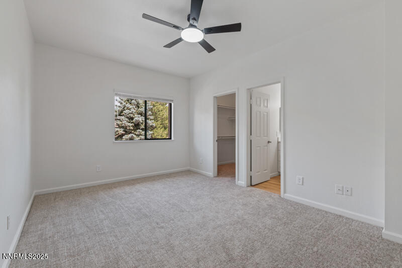 900 South Meadows Parkway, Unit 3322 Reno, NV 89521 - Photo 9 of 35 an empty room with windows and fan