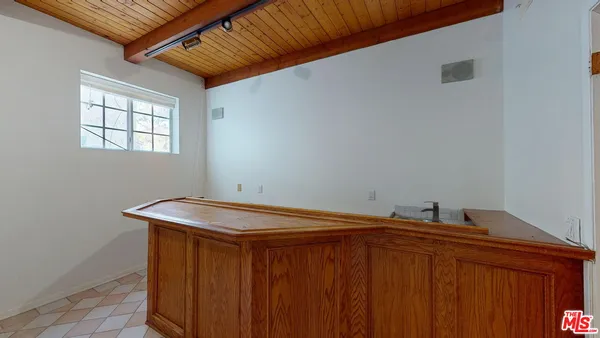 a bathroom with a sink and a window