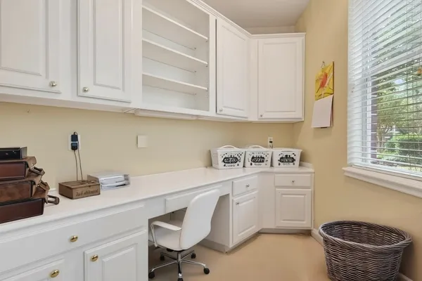 a kitchen with a sink cabinets and window