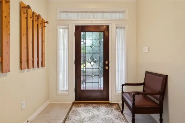 a view of a livingroom with furniture and a window