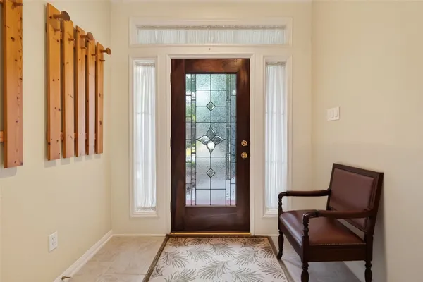 a view of a bedroom with furniture and windows