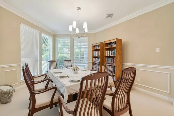 a view of a dining room with furniture window and outside view