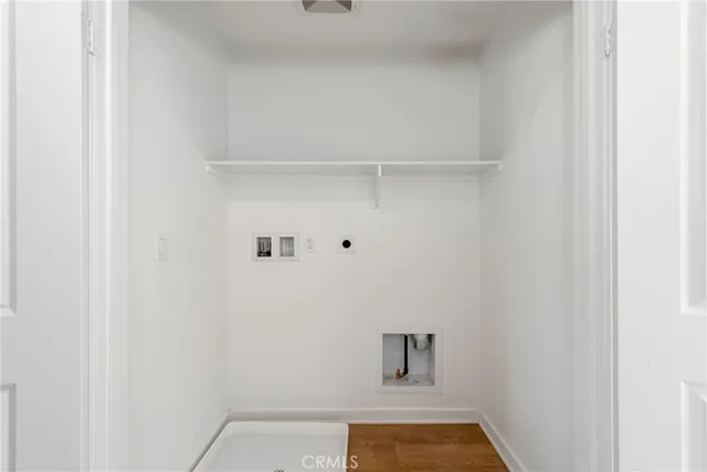 a living room with furniture and a lamp