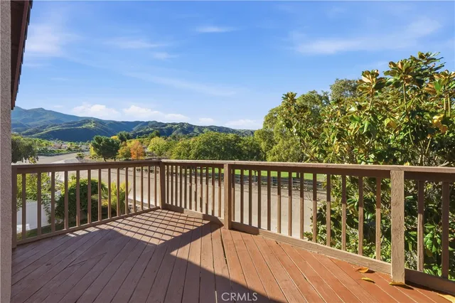 a view of balcony with wooden floor and city view