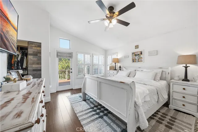 a spacious bedroom with a bed and a large window