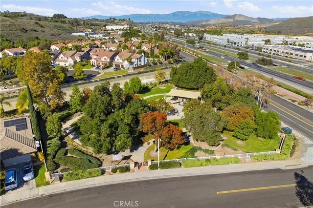 an aerial view of residential houses with outdoor space