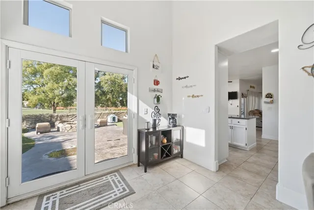 a view of a hallway with bathroom and outdoor space