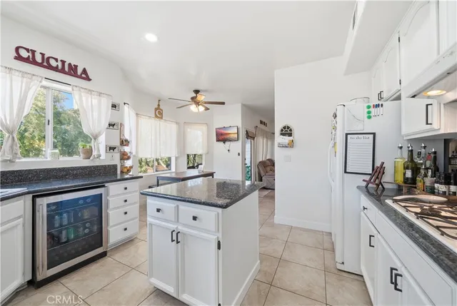 a kitchen with stainless steel appliances granite countertop a stove and a sink