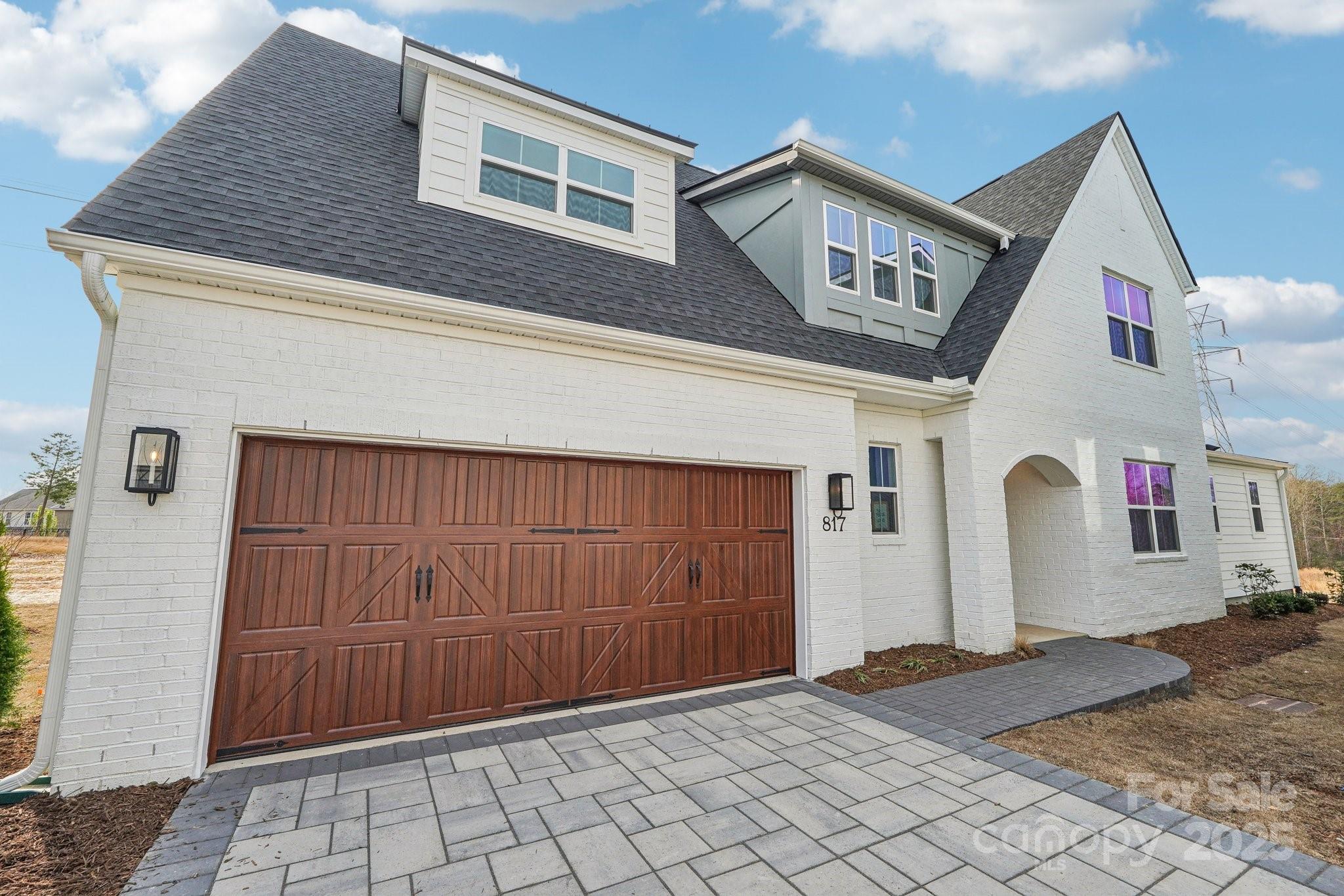 817 Terra Drive Tega Cay, SC 29708 - Photo 1 of 38 a front view of a house with a garage