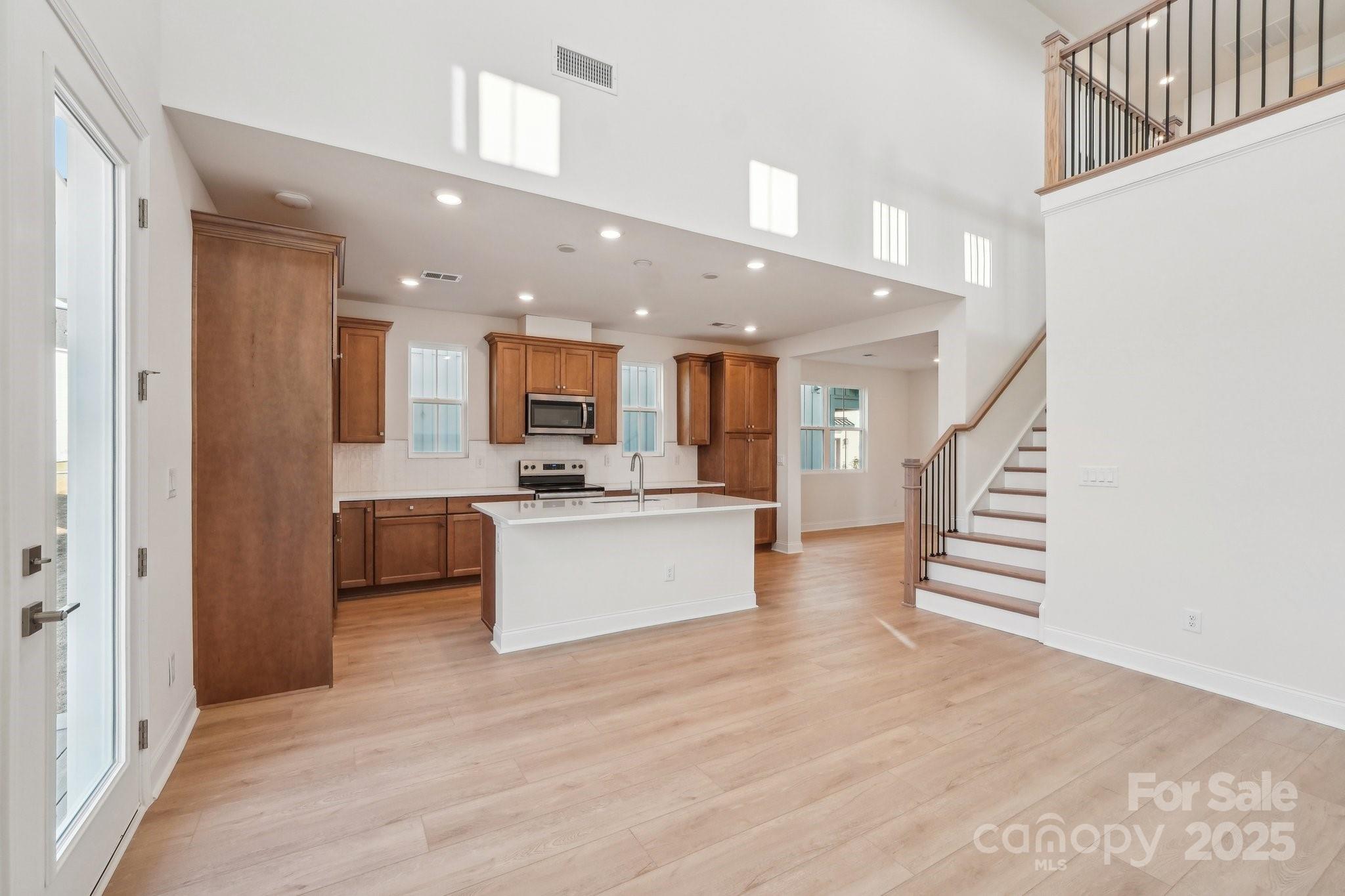 817 Terra Drive Tega Cay, SC 29708 - Photo 12 of 38 a view of kitchen and hall with wooden floor