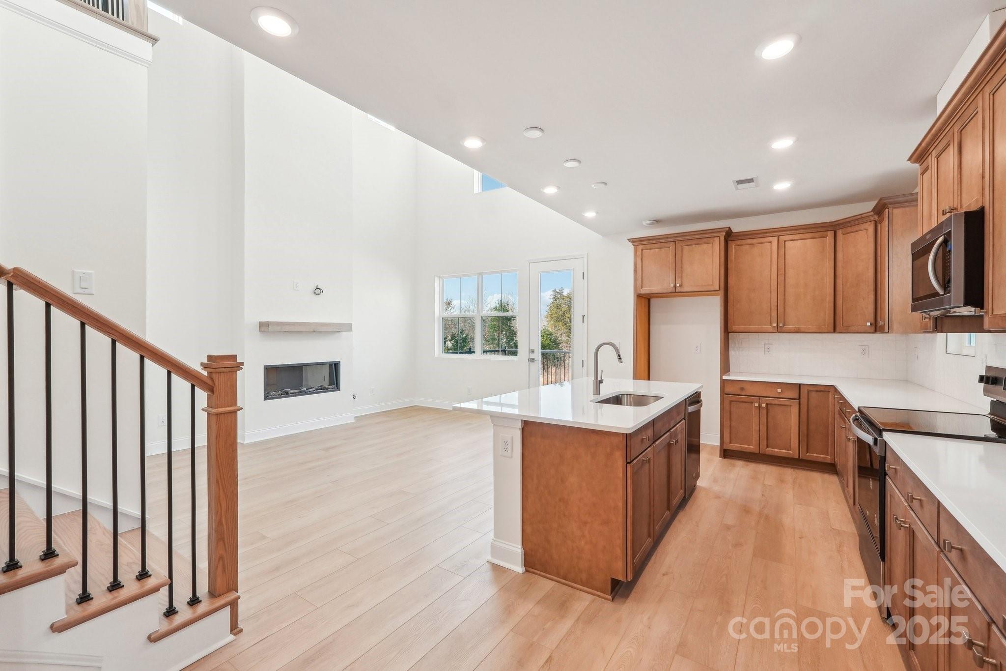 817 Terra Drive Tega Cay, SC 29708 - Photo 17 of 38 a kitchen with stainless steel appliances granite countertop a stove and a sink